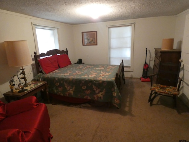 carpeted bedroom featuring a textured ceiling