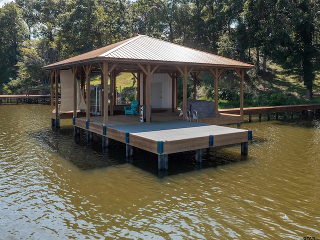 dock area with a water view and a gazebo