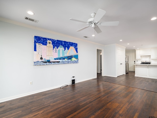 unfurnished living room featuring dark hardwood / wood-style flooring, ceiling fan, and crown molding