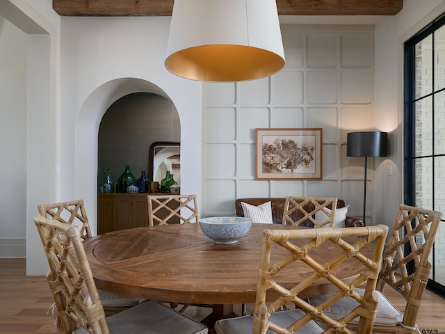 dining area with wood finished floors