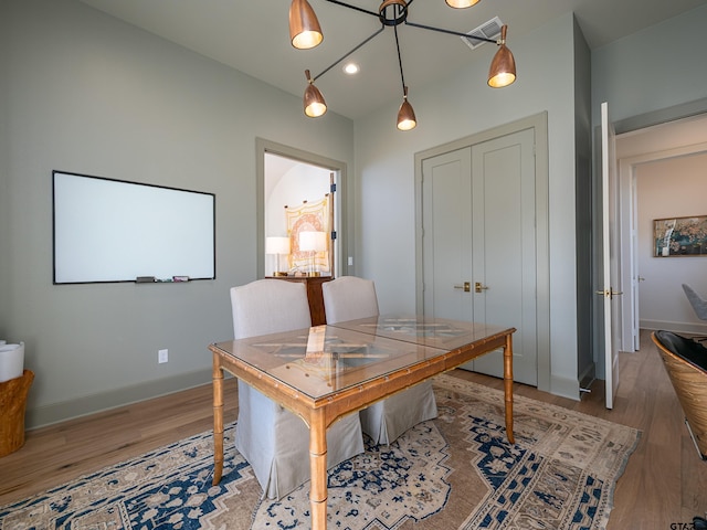 office space featuring light wood-type flooring, baseboards, and recessed lighting