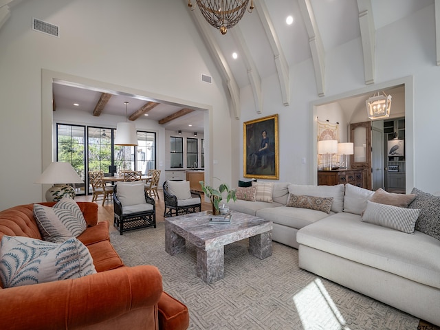 living area featuring visible vents, beamed ceiling, high vaulted ceiling, a notable chandelier, and recessed lighting