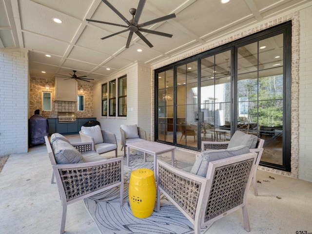 view of patio featuring an outdoor kitchen, outdoor lounge area, a ceiling fan, and area for grilling