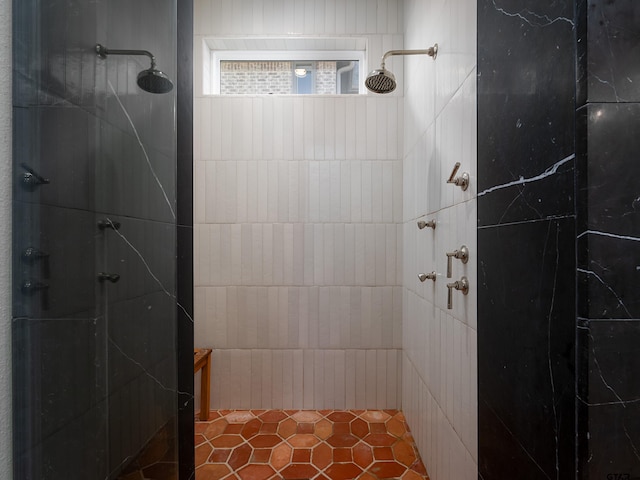 bathroom with a tile shower