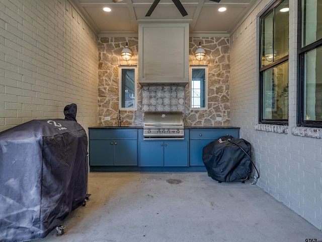 view of patio with a sink and area for grilling