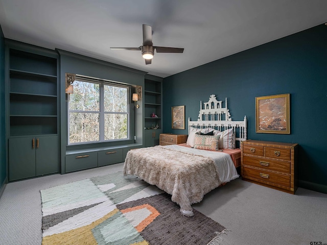 carpeted bedroom with a ceiling fan