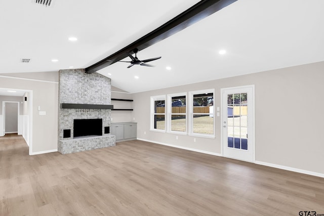 unfurnished living room featuring vaulted ceiling with beams, light wood-style flooring, baseboards, and a ceiling fan