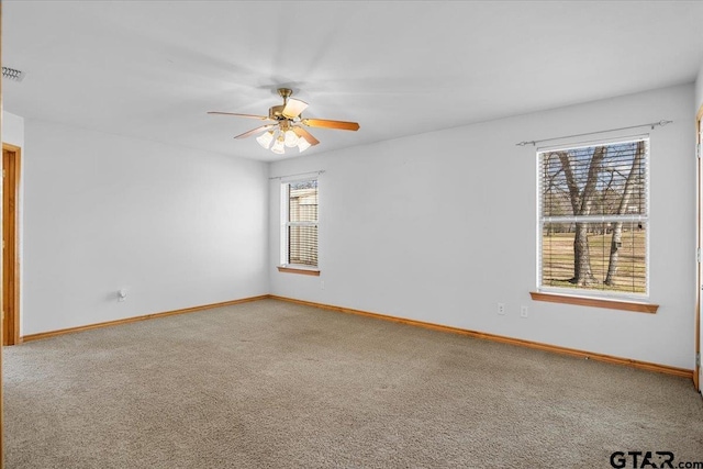 unfurnished room with carpet and ceiling fan