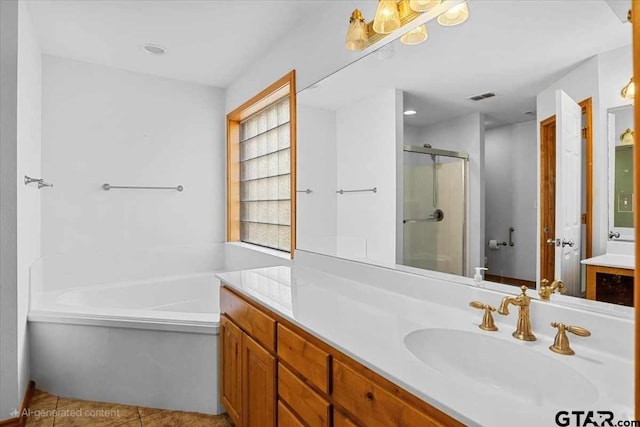 bathroom featuring vanity, tile patterned floors, and shower with separate bathtub