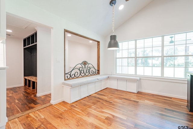 interior space with vaulted ceiling and light hardwood / wood-style floors