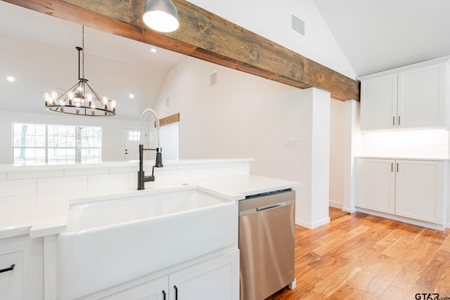 kitchen with dishwasher, white cabinetry, sink, light hardwood / wood-style flooring, and lofted ceiling with beams