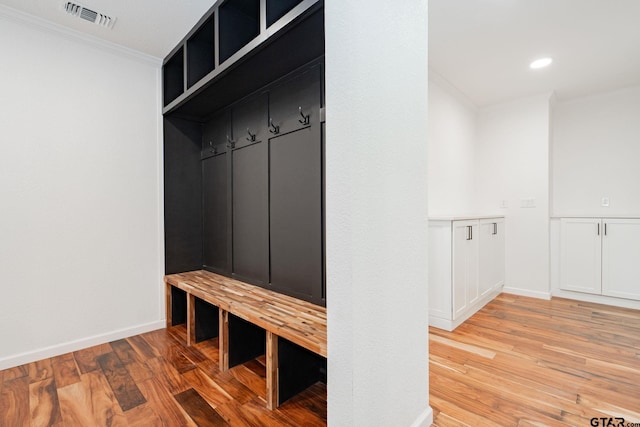 mudroom featuring light hardwood / wood-style flooring and ornamental molding