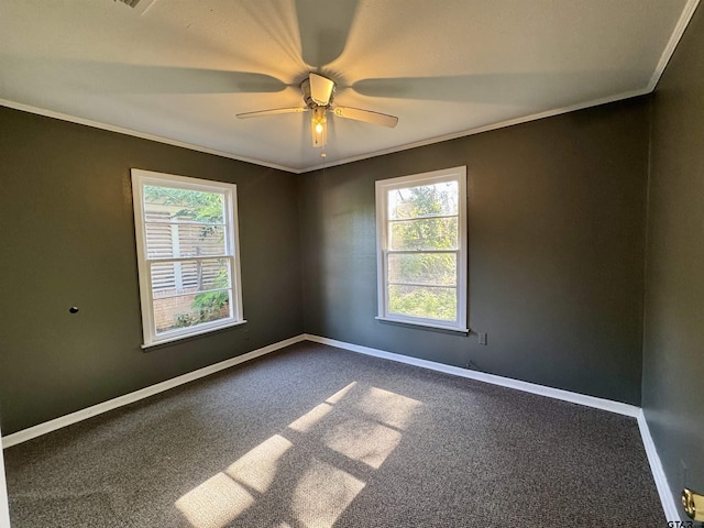1725 S Mahon Ave, Tyler, TX 75701 - unfurnished room with ornamental molding, healthy amount of natural light, dark carpet, and a ceiling fan