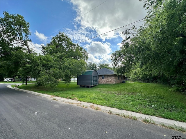 exterior space with a shed