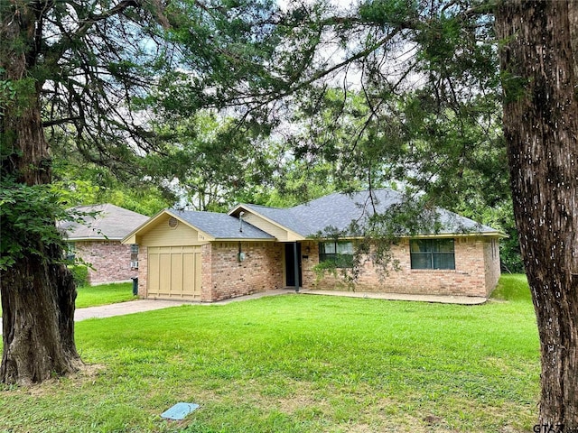 ranch-style house with a front yard and a garage