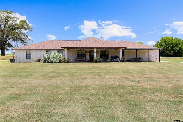 10929 County Road 41, Tyler, TX 75706 - view of front of home with a front lawn and brick siding
