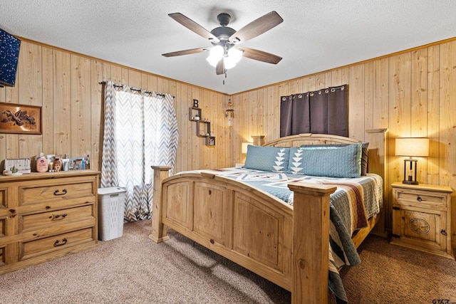 10929 County Road 41, Tyler, TX 75706 - bedroom featuring carpet floors, wooden walls, a textured ceiling, ornamental molding, and a ceiling fan