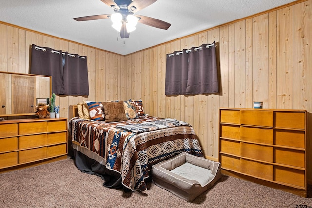 10929 County Road 41, Tyler, TX 75706 - bedroom with carpet, wood walls, crown molding, a ceiling fan, and a textured ceiling