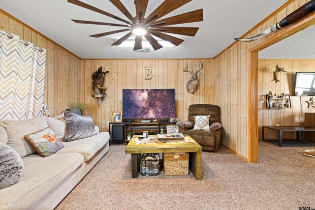 10929 County Road 41, Tyler, TX 75706 - carpeted living room featuring wood walls, a ceiling fan, ornamental molding, and a textured ceiling