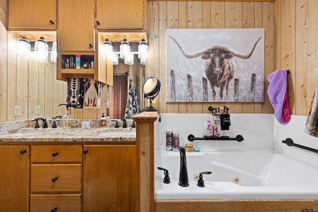 10929 County Road 41, Tyler, TX 75706 - full bathroom with wood walls, double vanity, and a jetted tub