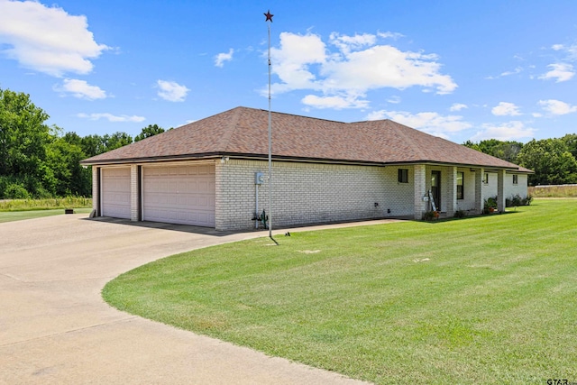 10929 County Road 41, Tyler, TX 75706 - view of side of home with a yard, brick siding, an attached garage, concrete driveway, and roof with shingles
