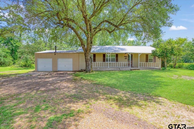 3268 Farm Rd Unit 1487, Bogata, TX 75417 - ranch-style home featuring a porch, a front lawn, driveway, board and batten siding, and an attached garage