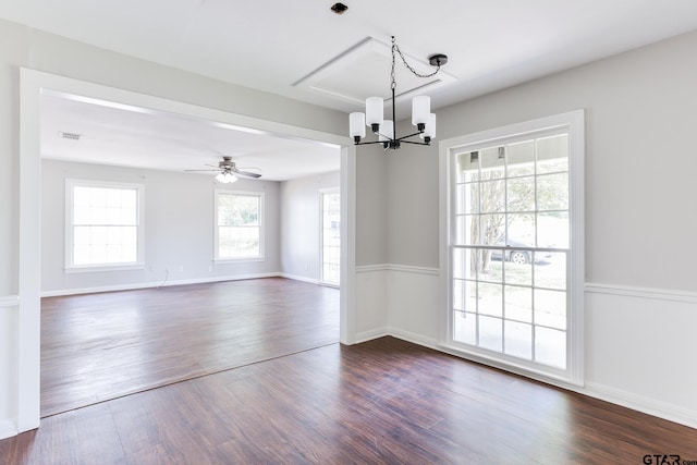 620 Dulse St, Tyler, TX 75701 - empty room with a chandelier, dark wood-style floors, and a ceiling fan