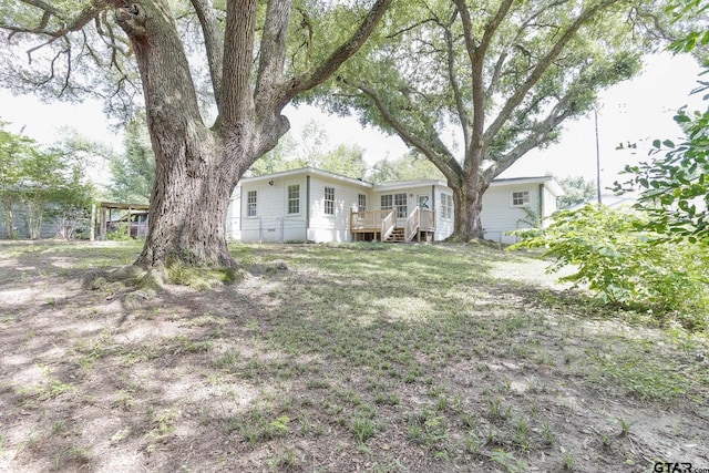 620 Dulse St, Tyler, TX 75701 - view of yard with a deck and stairs
