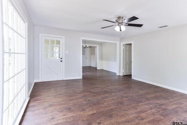 620 Dulse St, Tyler, TX 75701 - unfurnished room with ceiling fan, dark wood-style flooring, and a chandelier