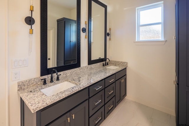 bathroom with tile patterned flooring and vanity