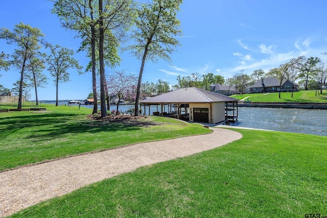 view of home's community with a gazebo, a lawn, and a water view