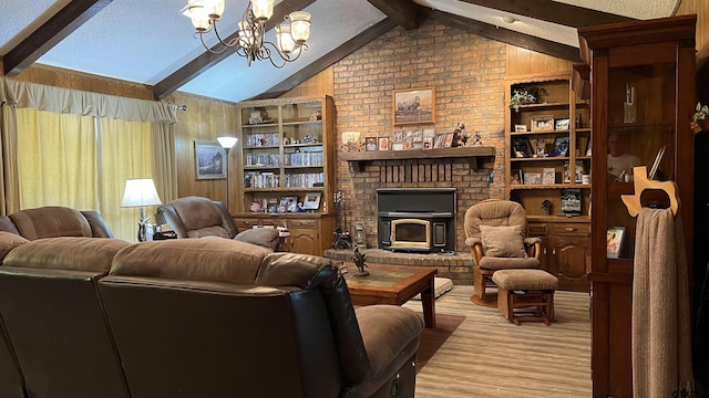 living room with wood walls, lofted ceiling with beams, a notable chandelier, light wood-type flooring, and built in shelves