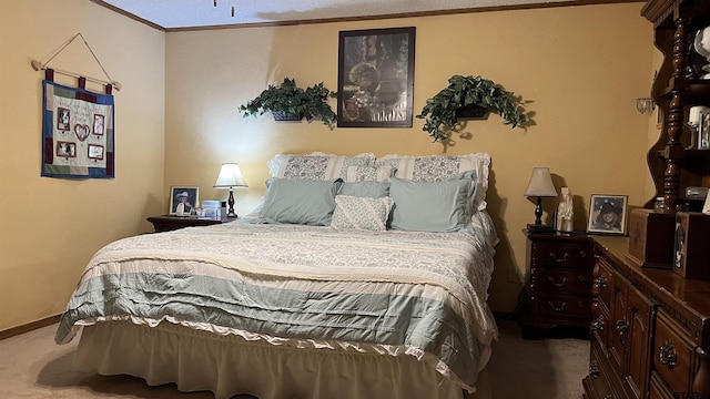 bedroom with crown molding and carpet flooring