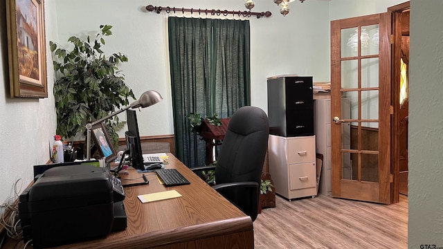 office with light hardwood / wood-style flooring