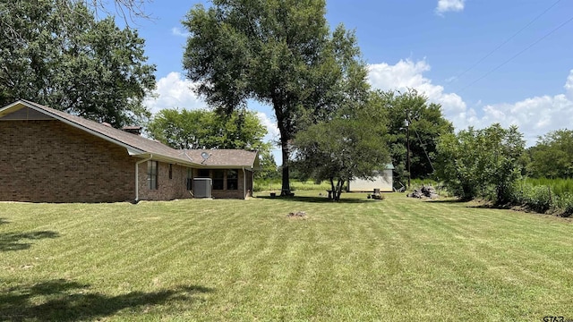 view of yard with central AC unit