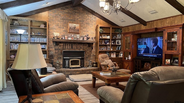 living room with wooden walls, vaulted ceiling with beams, light wood-type flooring, a notable chandelier, and a textured ceiling