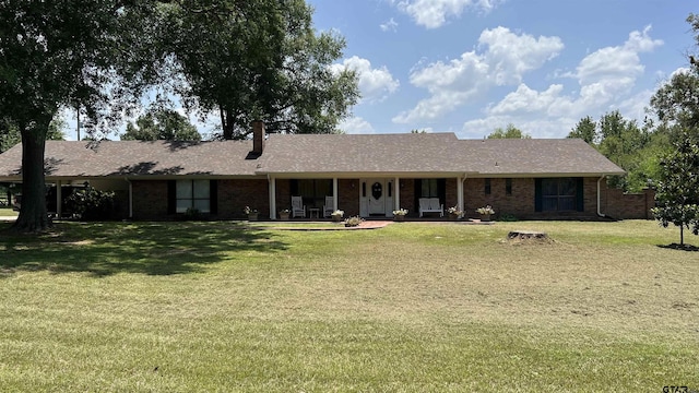 ranch-style home with a front lawn