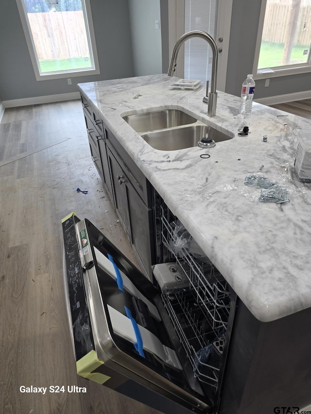 913 Alex Dr, Whitehouse, TX 75791 - kitchen featuring healthy amount of natural light, light stone countertops, and light wood-type flooring