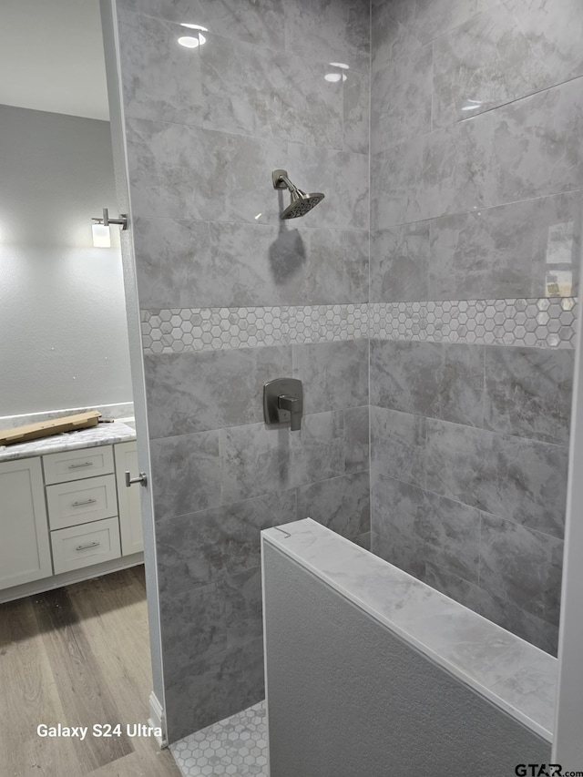 913 Alex Dr, Whitehouse, TX 75791 - bathroom with wood finished floors, walk in shower, and vanity