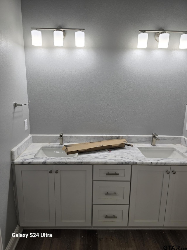 913 Alex Dr, Whitehouse, TX 75791 - bathroom with double vanity and wood finished floors