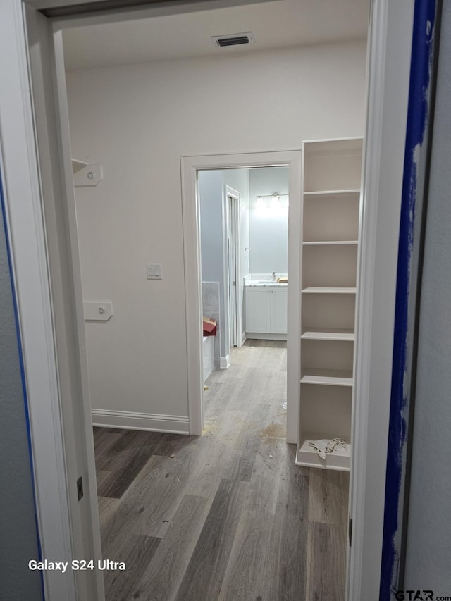 913 Alex Dr, Whitehouse, TX 75791 - hallway featuring wood finished floors and baseboards