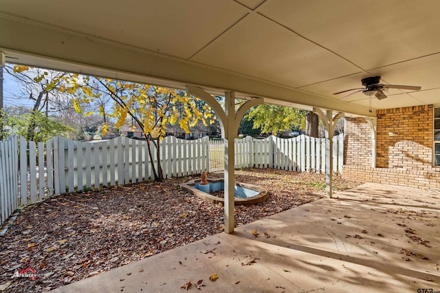 view of patio featuring ceiling fan