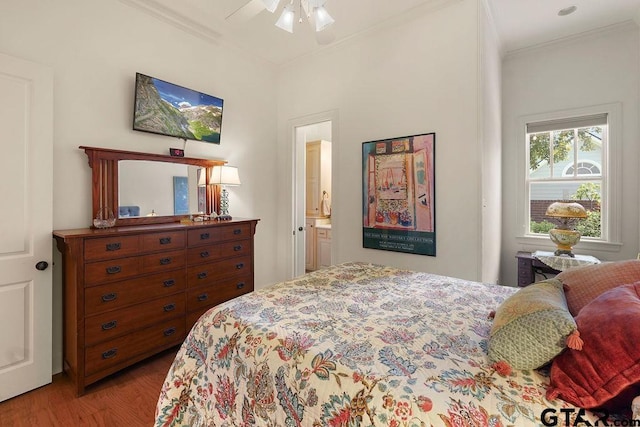 4007 Spartanburg Ln, Tyler, TX 75701 - bedroom featuring crown molding, wood finished floors, and ensuite bathroom