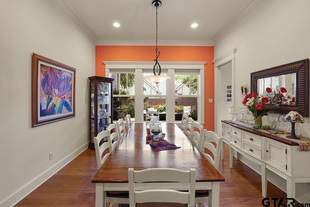 4007 Spartanburg Ln, Tyler, TX 75701 - dining area with dark wood-style flooring, crown molding, baseboards, and recessed lighting