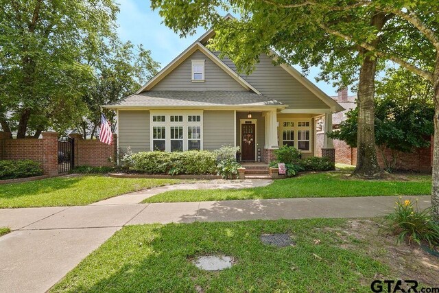 4007 Spartanburg Ln, Tyler, TX 75701 - view of front facade featuring a gate and roof with shingles