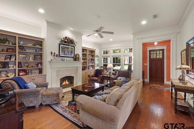 4007 Spartanburg Ln, Tyler, TX 75701 - living room with ceiling fan, hardwood / wood-style floors, a high end fireplace, crown molding, and recessed lighting
