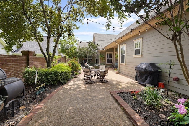 4007 Spartanburg Ln, Tyler, TX 75701 - view of patio featuring grilling area and outdoor dining area