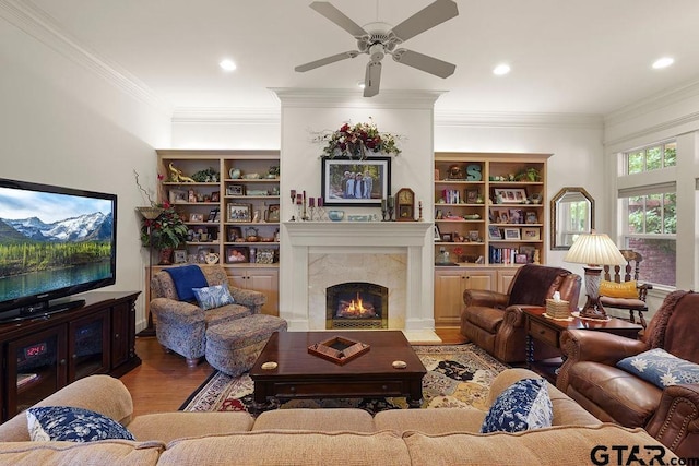 4007 Spartanburg Ln, Tyler, TX 75701 - living area featuring wood finished floors, ceiling fan, a tile fireplace, ornamental molding, and recessed lighting