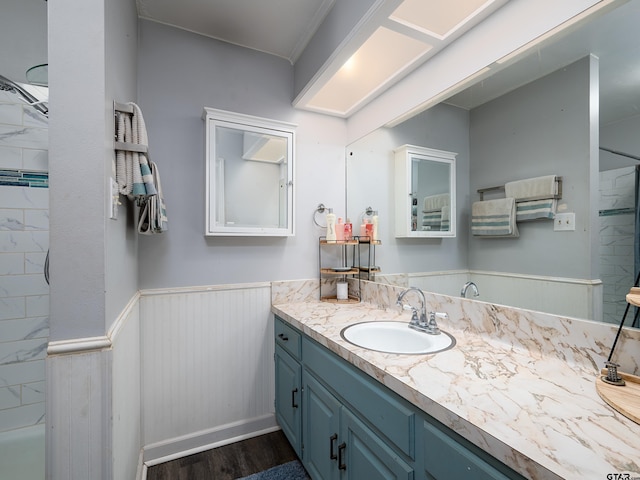 bathroom with vanity, hardwood / wood-style floors, and shower / bathing tub combination