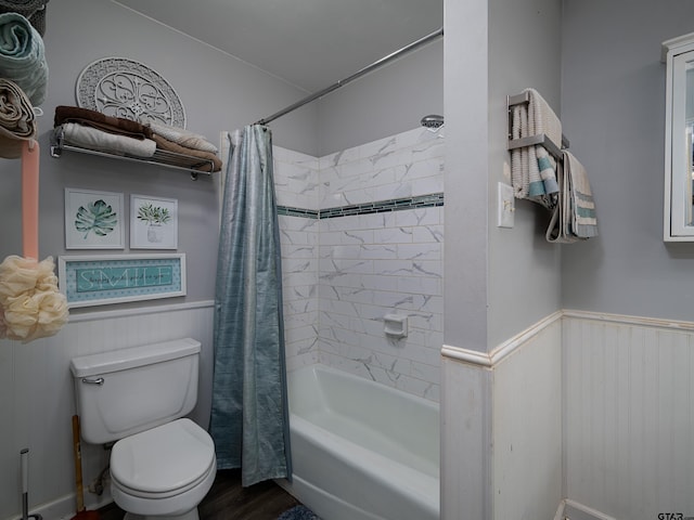 bathroom with shower / tub combo with curtain, wood-type flooring, and toilet